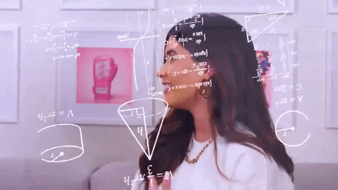 A person works through a confusing set of equations.